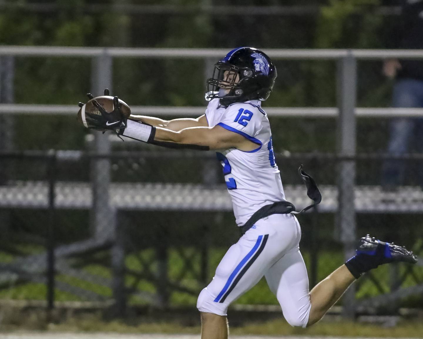 St. Francis's Dario Milivojevic (12) hauls in a sideline pass and runs into the endzone during football game between St. Francis at Kenwood Academy on Thursday, Aug 28, 2025  in Chicago.