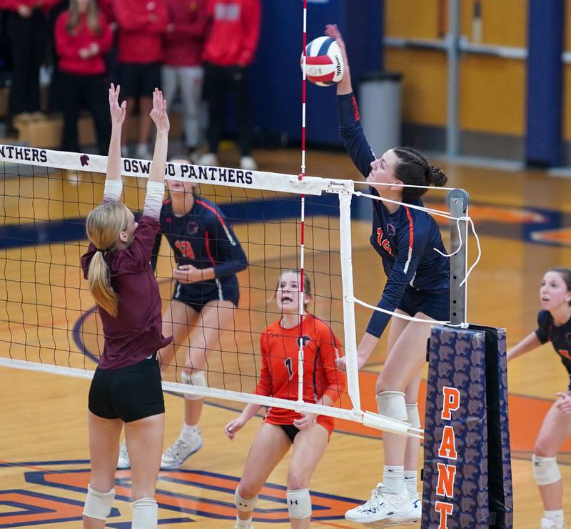 Oswego’s Mia Jurkovic (14) goes up for a kill against Lockport during a class 4A Oswego Sectional semifinal match at Oswego High School on Monday, Oct. 30, 2023.