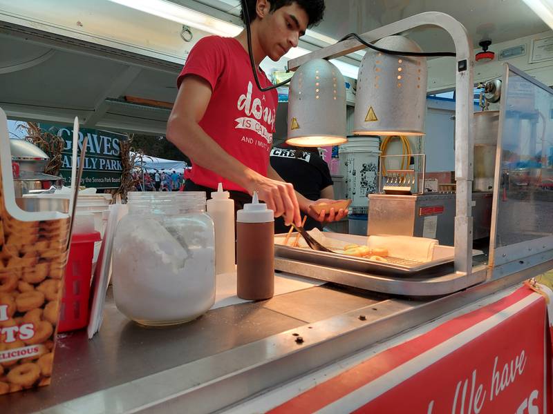 Homemade apple cider doughnuts are seasoned with cinnamon and topped with caramel Saturday, Sept. 23, 2023, from Sugar Mama's Donuts at the Shipyard Days festival in Seneca.