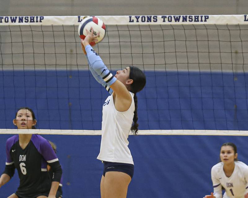 Downers Grove South's Jennifer Curran (14) sets a shot during Class 4A Lyons Sectional Semifinal volleyball match between Downers Grove South at Downers Grove North. Nov 4, 2025 in La Grange.