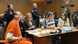 The first parents convicted in a U.S. mass school shooting each sentenced to at least 10 years in prison in Michigan