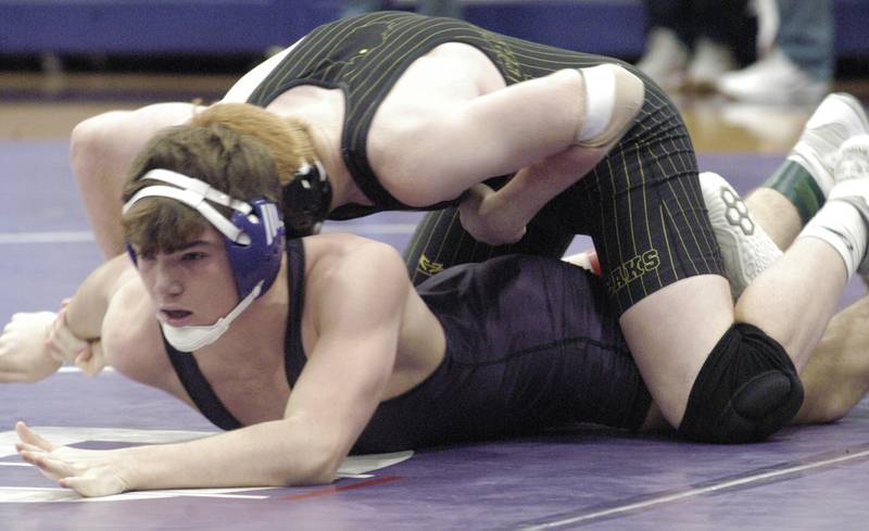 Dixon's Daniel Fordham tries to escape from Galesburg's Mason Taylor in the 175-pound third-place bout at the Class 2A Dixon Regional on Saturday, Feb. 8, 2025 at Lancaster Gym in Dixon.