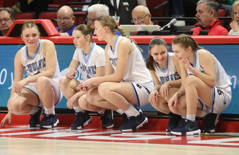 Cissna Park's Mady Marcott, Macy Sinn, Annika Stadeli, Faith Bohlmann and Grace Bohlmann wait to check in the game late in the fourth quarter during the Class 1A third place game on Friday, March 7, 2025 at CEFCU Arena in Normal.