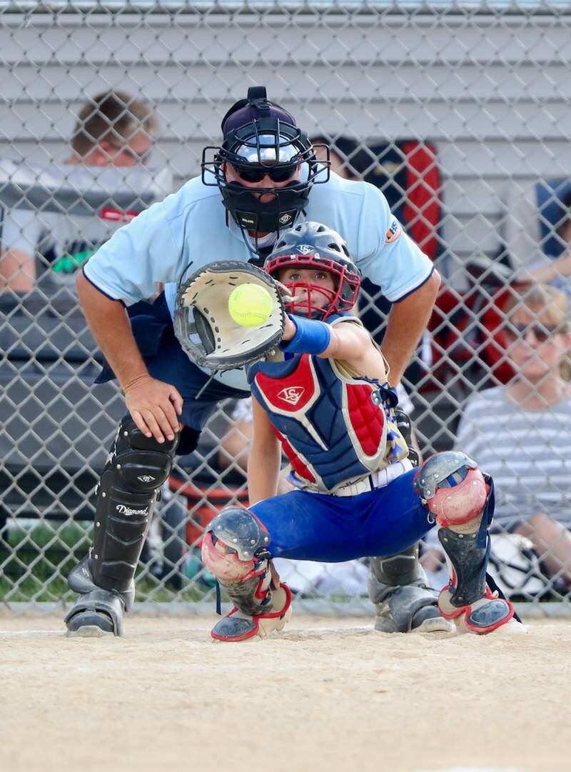 Plate umpire Ed Deirix gets a good look at the pitch as Princeton Logan catcher Kiyrra Morris squeezes the ball in Thursday's season opener.