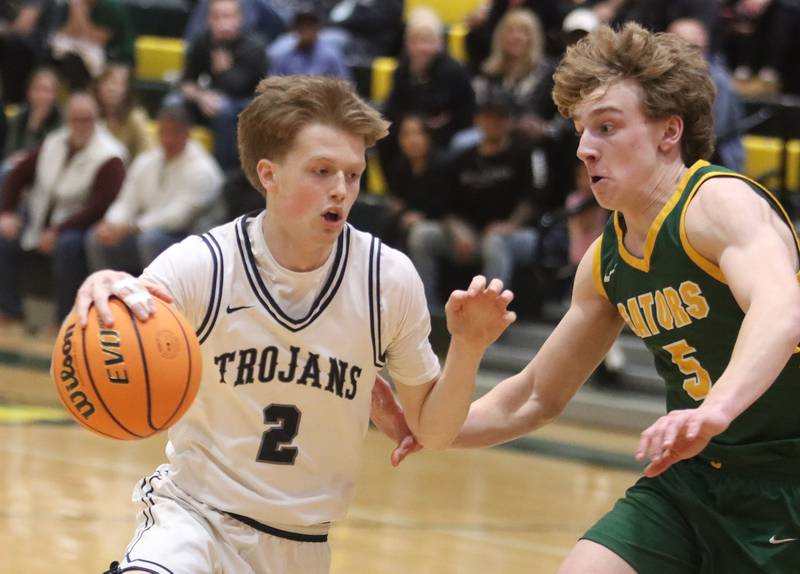Crystal Lake South’s Carson Trivellini, right, guards Cary-Grove’s AJ Berndt  in boys IHSA Class 3A Regional Championship basketball on Friday, Feb. 27, 2026, at Crystal Lake South High School in Crystal Lake.