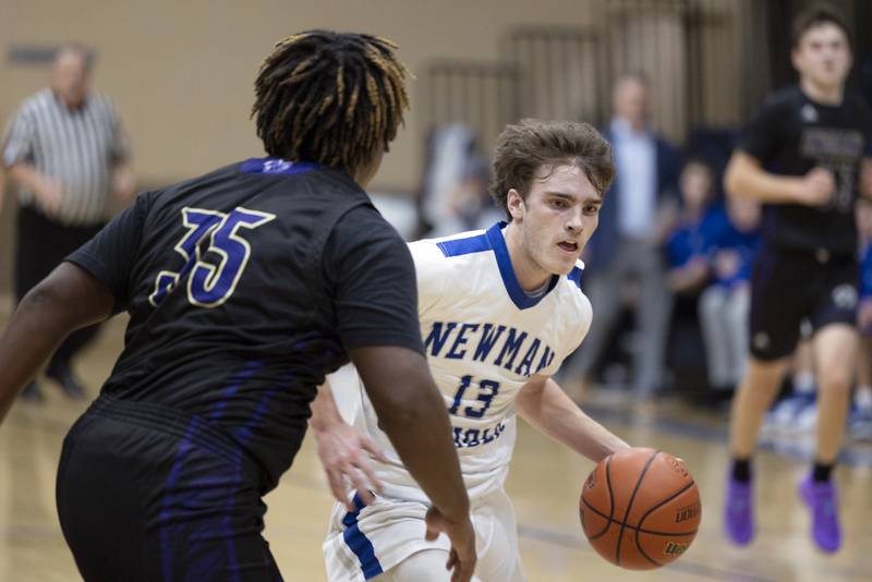 Newman’s Nolan Britt handles the ball Tuesday, Dec. 13, 2022 against Pecatonica’s Briaun Green.