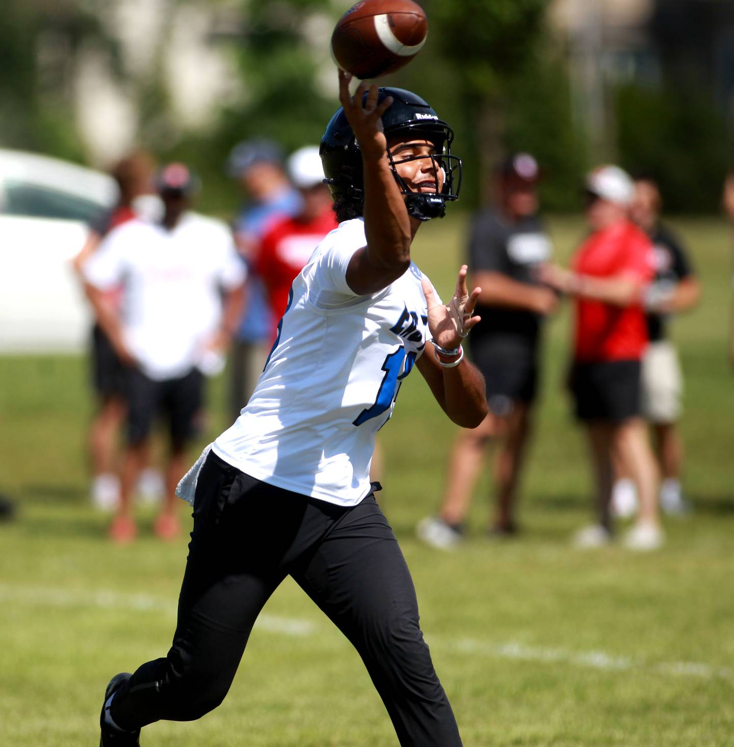 Lincoln-Way East quarterback Jonas Williams fires the ball during a 7-on-7 tournament at Naperville North on Thursday, June 27, 2024.
