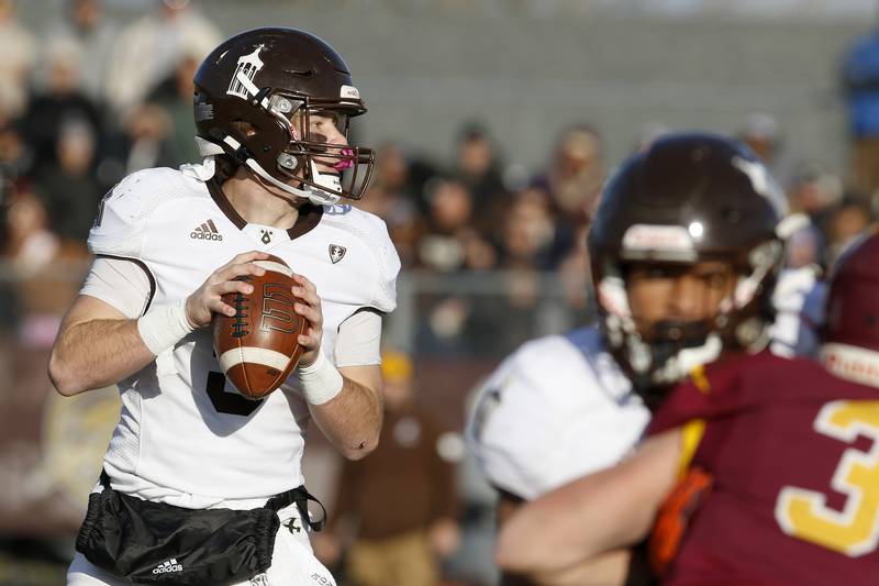 Joliet Catholic quarterback Aidan Voss looks for an open man during their IHSA Class 4A semifinal football game on Saturday, Nov. 20, 2021 at Richmond-Burton High School in Richmond. Joliet Catholic won 35-18, delivering Richmond-Burton their first loss in three years.