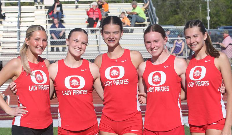 Members of the Ottawa track team pose for a photo during the Interstate 8 Conference girls track championship on Friday, May 9, 2025 at Morris High School.