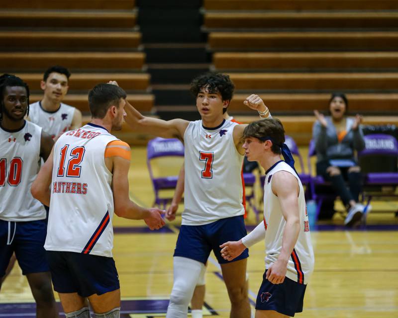 Oswego's Jack Hawkins (7) celebrates a point with teammates during Downers Grove North Regional final match between Oswego at Downers Grove North. May26, 2022