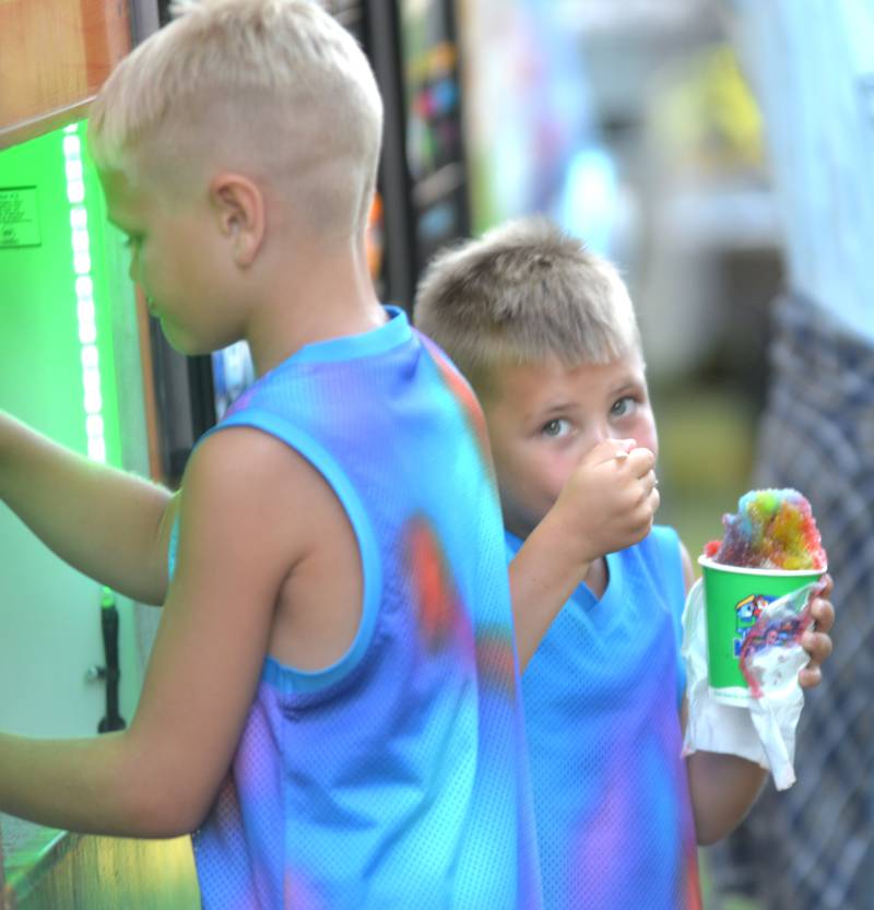 Kids enjoy Kona shaved ice during the Oregon Park District's Concert in the Park on Tuesday, July 1, 2025 at Oregon Park West.