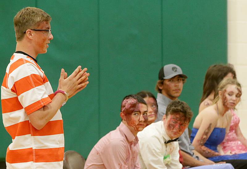 Andrew Salisbury, a student at Leland High School, speaks to classmates on his experience after participating in a Mock Prom drill at Leland High School on Friday, May 6, 2022 in Leland.