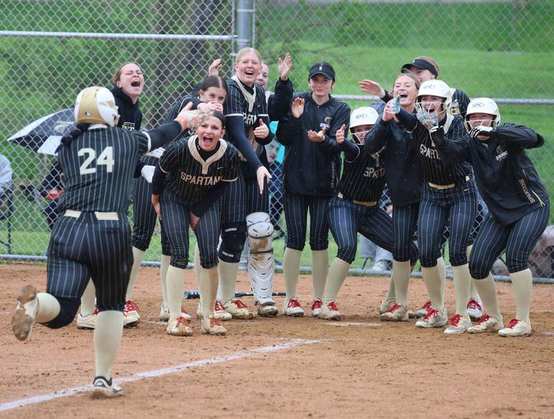 Sycamore’s Kairi Lantz heads to her waiting teammates after homering Thursday, April 30, 2026, during their game against LaSalle-Peru at Sycamore High School.