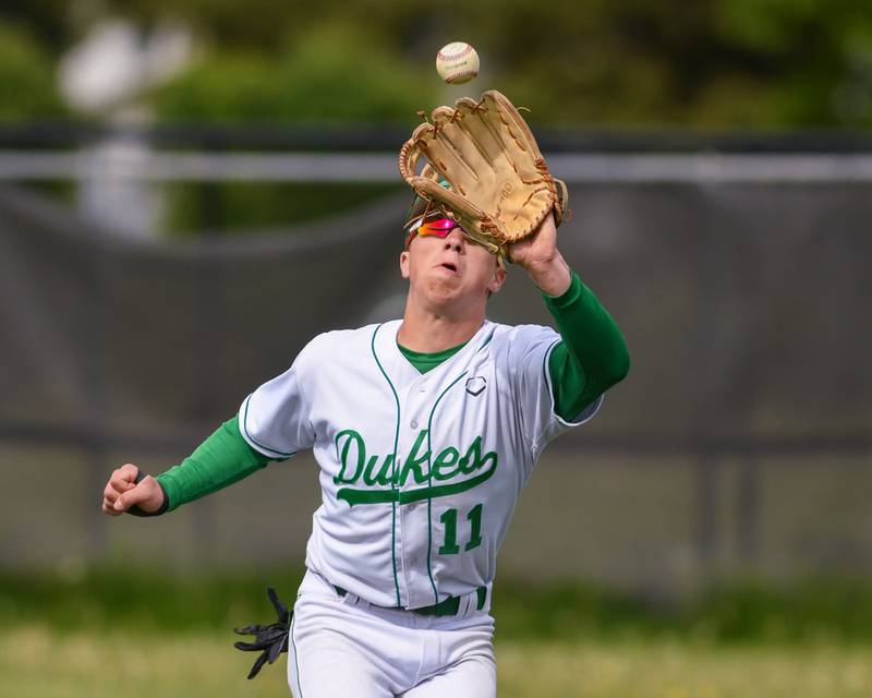 York's Marco Giorno (11) catches the ball for an out on Monday May 19, 2025, during the game against Downers Grove North held at York High School in Elmhurst.
