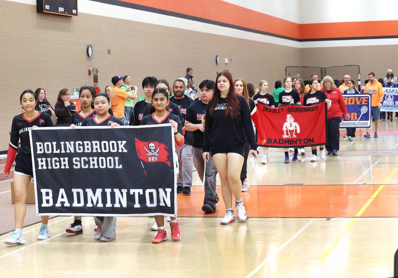 Schools take part in the parade of teams Friday, May 10, 2024, during the IHSA State Badminton Finals at DeKalb High School.