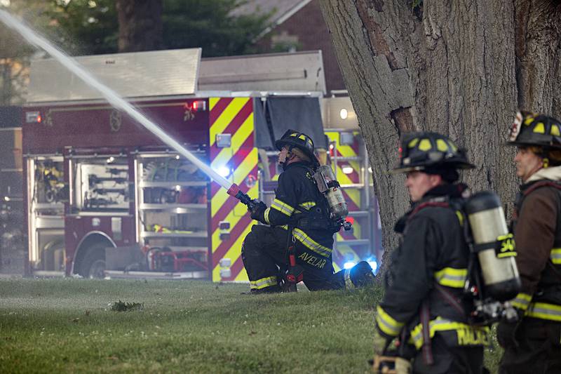 Firefighters battle a house fire Wednesday, June 26, 2024 at 1501 First Avenue in Sterling. Multiple departments responded to the scene including Sterling, Rock Falls, Dixon, Amboy, Morrison and Prophetstown.