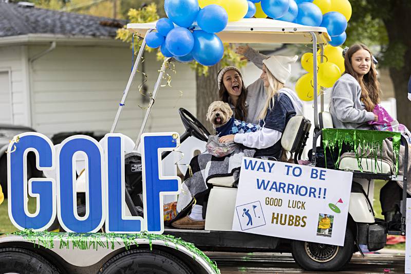 The Sterling golf team rides through the homecoming parade Friday, Oct.6, 2023. Sterling junior Mason Hubbard will be competing this weekend at the state golf meet.