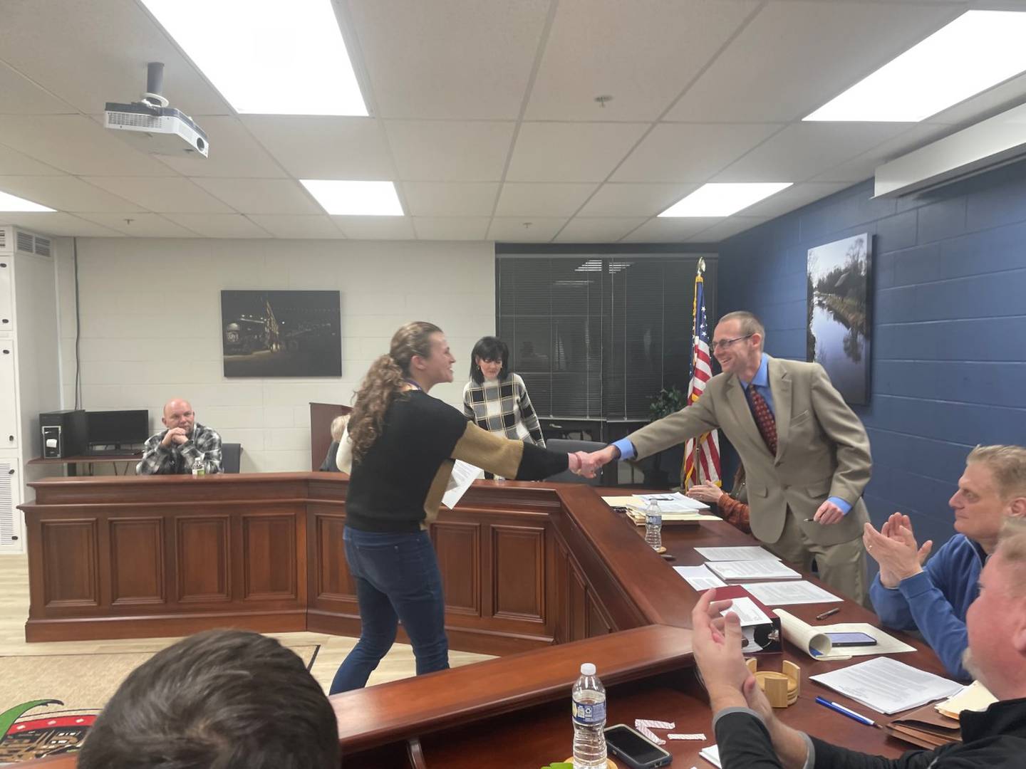 Britnee Eccles of the Canal Corridor Association shakes hands with Utica Mayor David Stewart after Stewart issued a proclamation marking the 175th Anniversary of the Illinois and Michigan Canal through April 2024.