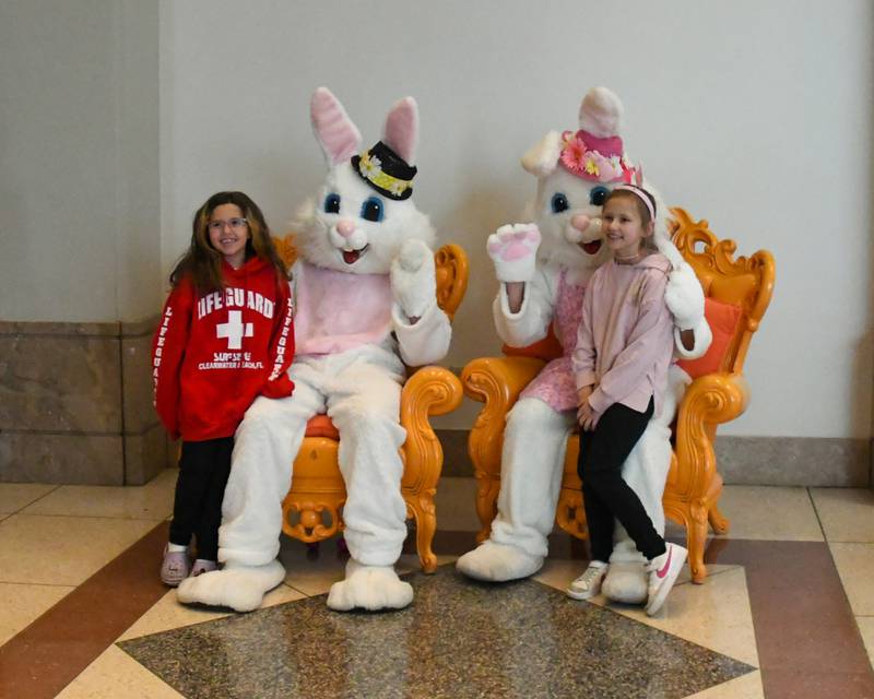 Gianna Pacini, 8, and friend Julia Rudny, 8, both from Bartlett pose with the Easter Bunny at the Easter Egg Hunt event at Cantigny Park on Sunday March 24, 2024.