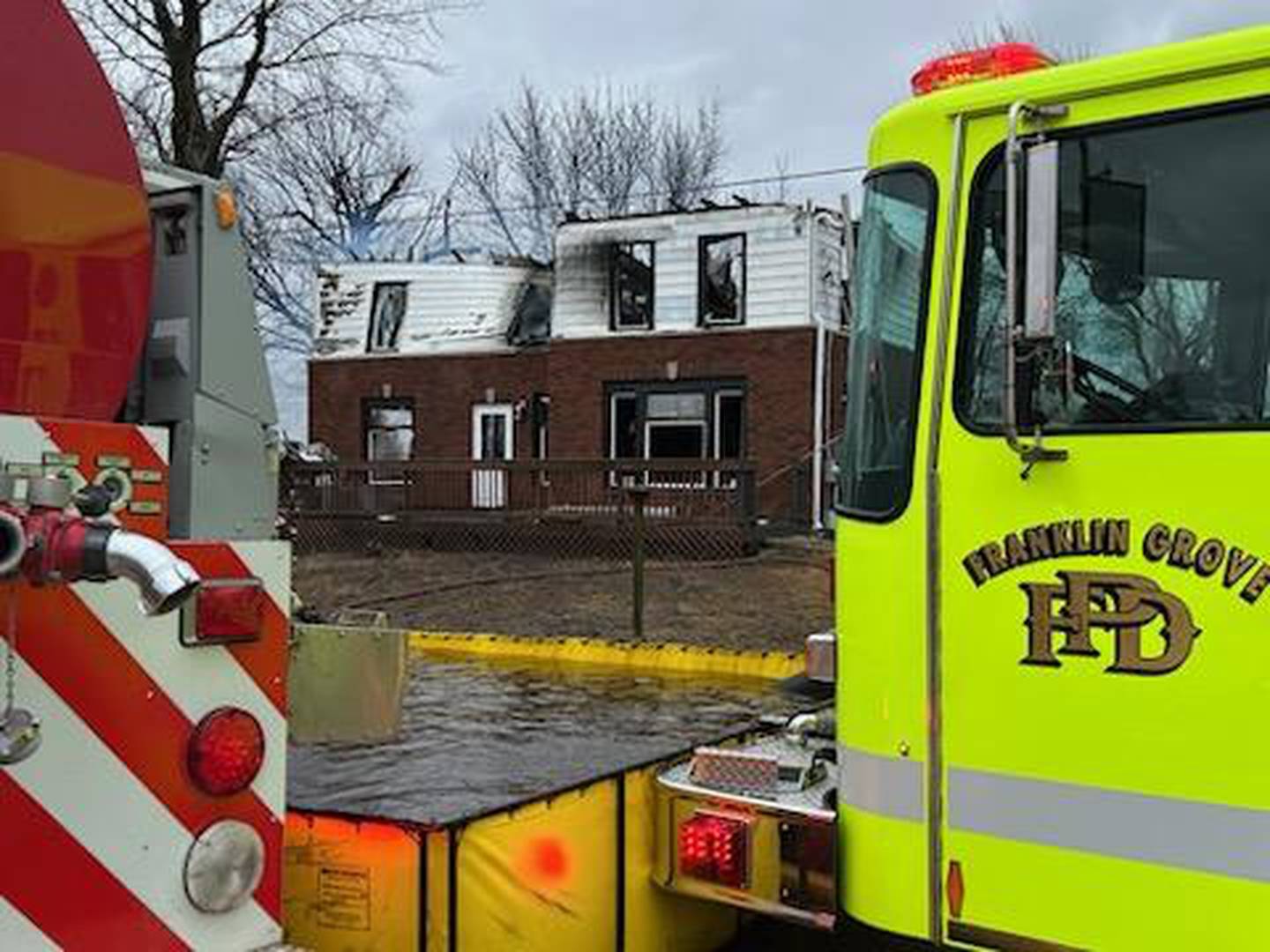 A Franklin Grove Fire Protection District vehicle is seen out front of 8423 state Route 38 in Ogle County near Ashton after being damaged by a fire Wednesday, March 5, 2025.