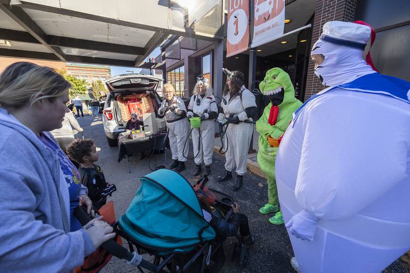 A group from KSB went all in on their Ghostbusters costumes. Ghost fighters Vicki Cover (left), Melinda Imel, Katie Cover, Connie Lipscomb as Slimer and Brian Melo as Stay Puff hand out candy Saturday, Oct. 26, 2024, in Dixon.