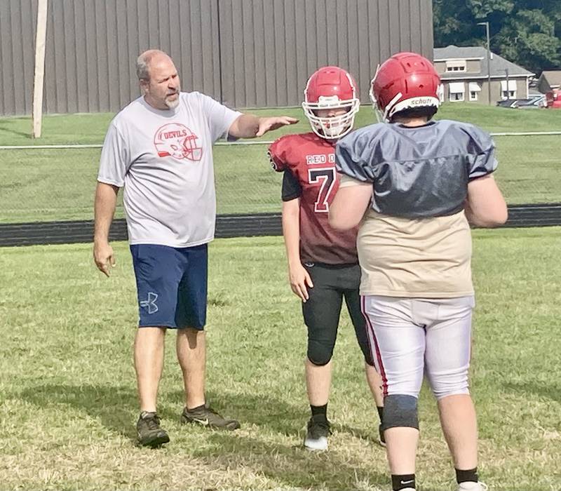 Hall alum Nick Sterling has returned as an assistant coach for the Red Devils this fall. He was a junior on Hall's 1996 state runner-up team.
