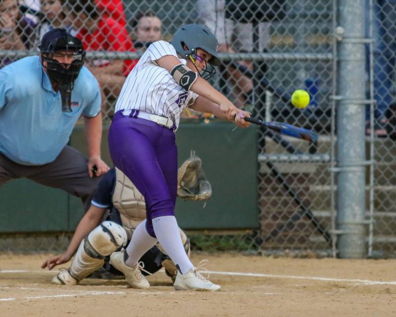 Downers Grove North's Maya Rodriguez (16) swings away during varsity softball game between Downers Grove South at Downers Grove North.  May 11, 2023.