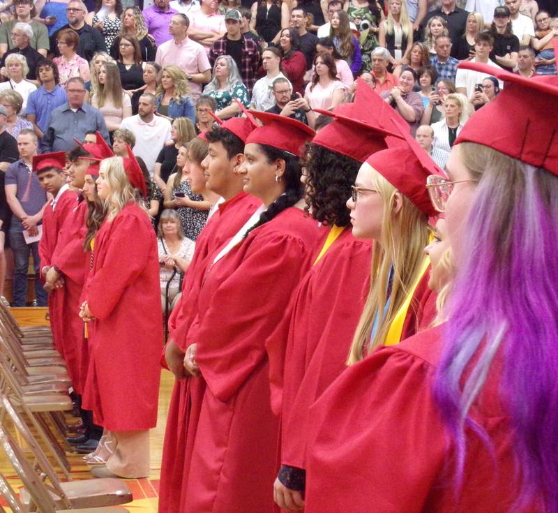 A row of Streator High School graduating seniors wait for their peers to walk into the gymnasium Sunday, May 21, 2023, to begin the ceremony.
