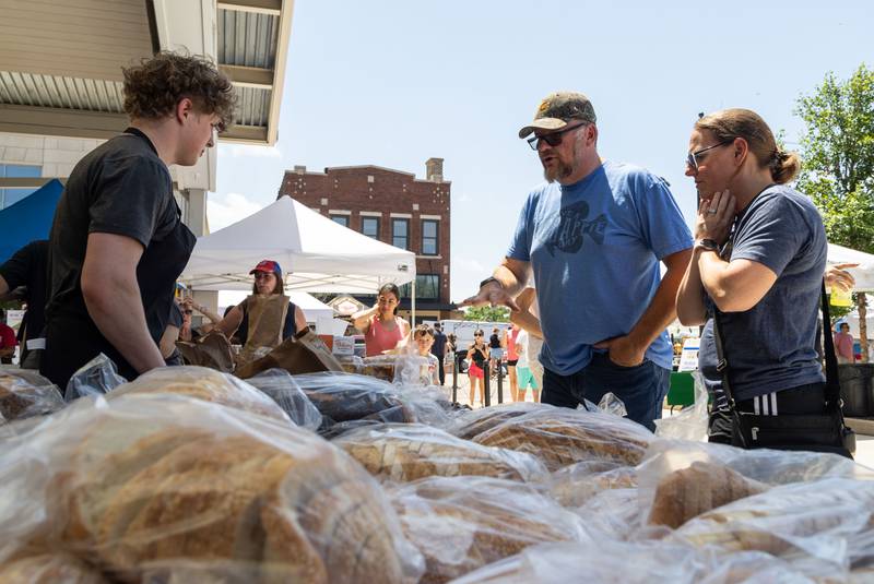 James and Tammy Balciunas of Alsip inquired about baked goods at the Hahn’s Bakery vendor tables during Make Music Wheaton and the Wheaton French Market in The Wheaton French Market Plaza on Saturday, June 21, 2025.