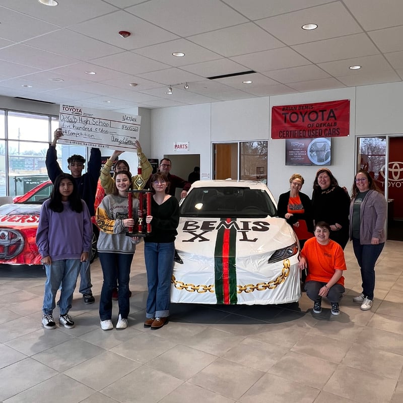 Brian Bemis Toyota of DeKalb recently held an art competition between DeKalb and Sycamore high schools. DeKalb High School won first place and received $500 and a trophy. Sycamore High School was awarded $250.