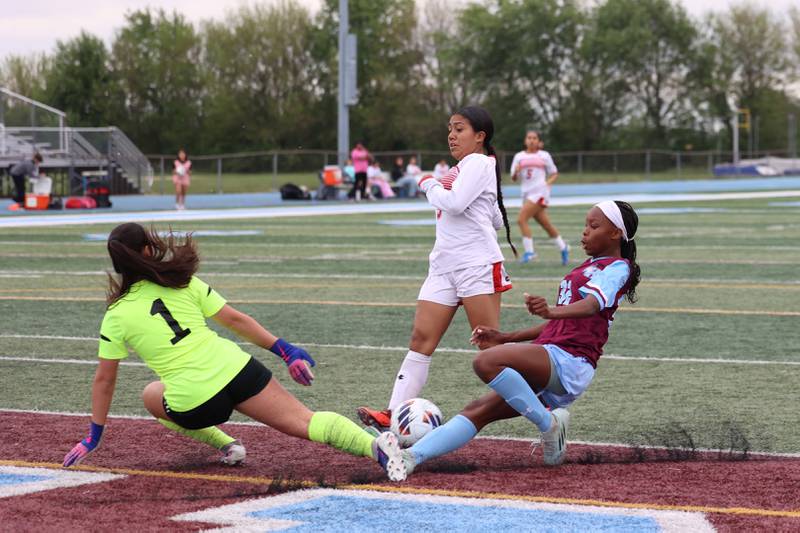 Kankakee's Alina Mkhwanazi slides in as she contests the goalkeeper during the Kays' 5-0 win against Blue Island Eisenhower in the Class 2A Kankakee Regional semifinals on Tuesday, May 19, 2026.