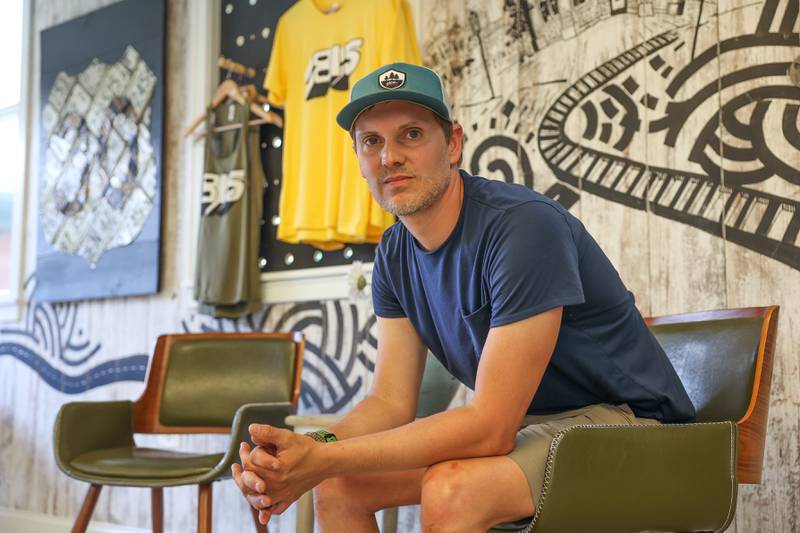 Andy Remley, co-owner of DNA - Active Lifestyle Outfitter, poses for a photo in his 815 venue rental space for small events in Downtown Plainfield on Thursday, June 1, 2023.