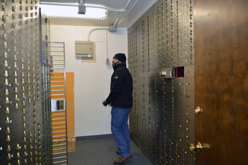 James Reynolds walks through one of several vaults in the Barber bank building in downtown Polo. The physical vault, built in the main lobby, is worth around $500,000. Reynolds and his wife, Cynthia, recently purchased the building and plan to restore and preserve it.