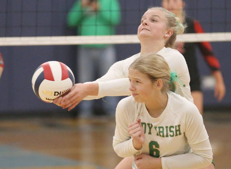 Seneca's Lainie Olson hits the ball out of bounce as teammate Graysen Provance ducks out of the way in the Class 2A Sectional semifinal game on Tuesday, Nov. 5, 2024 at Bureau Valley High School.