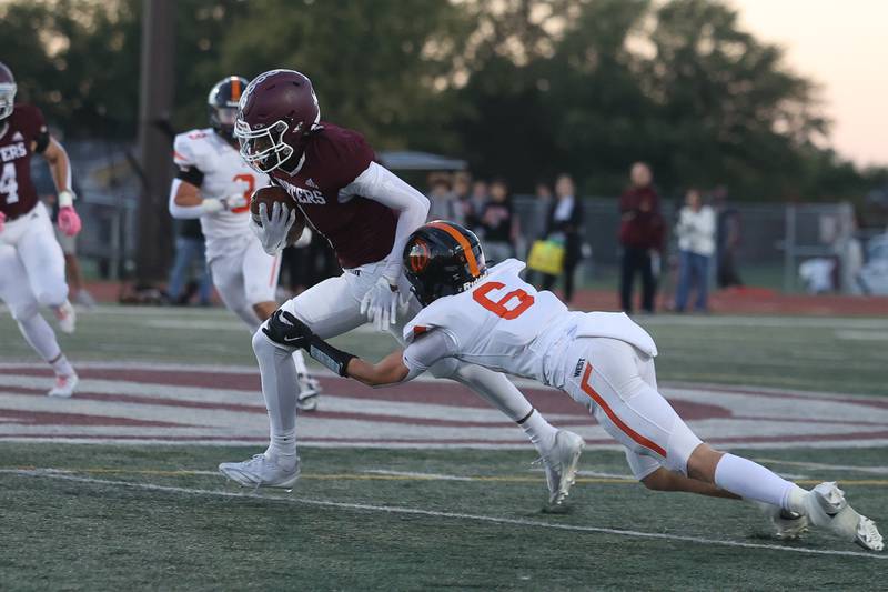 Lockport’s Izeyah Pruitt evades a tackle after a catch against Lincoln-Way West on Friday, Oct. 18, 2024 in Lockport.