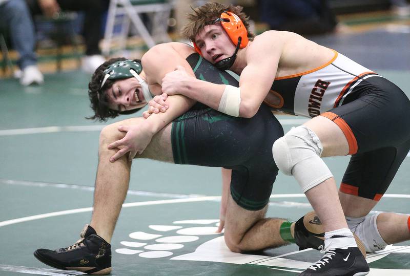 St. Bede's Andre Pineda wrestles Sandwich's Josh Lehman in the 157 pound weight class during the Class 1A Regional meet on Saturday, Feb. 8, 2025 at St. Bede Academy.