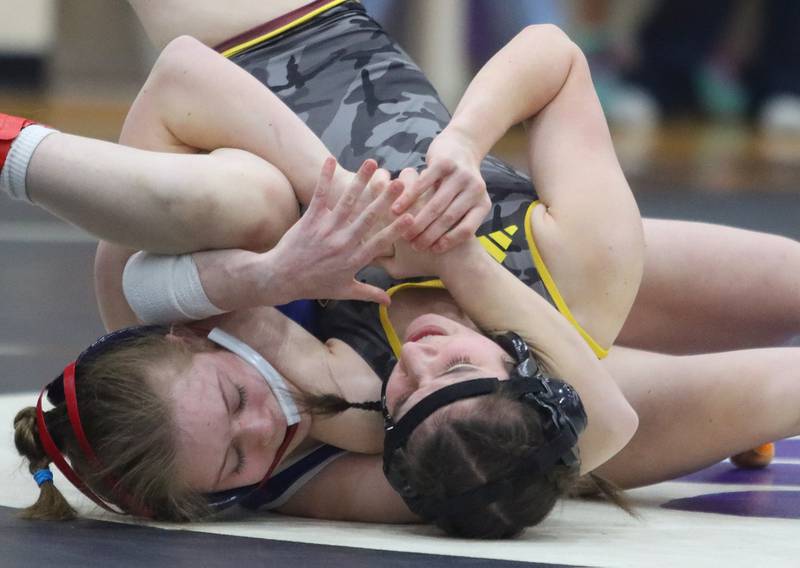 Richmond-Burton’s Madison Lunbar, right, battles St. Viator’s Evalyn Idzik at 110 pounds in IHSA Regional wrestling action on Saturday, Feb. 1, 2025, at  Hampshire High School  in Hampshire.