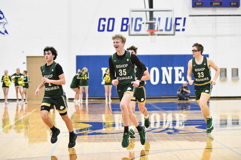 Bishop McNamara's Richie Darr (35) celebrates at halftime ahead of the Fightin' Irish's 79-67 victory over Joliet Catholic Academy in the IHSA Class 2A Peotone Sectional semifinal on March 4, 2025.