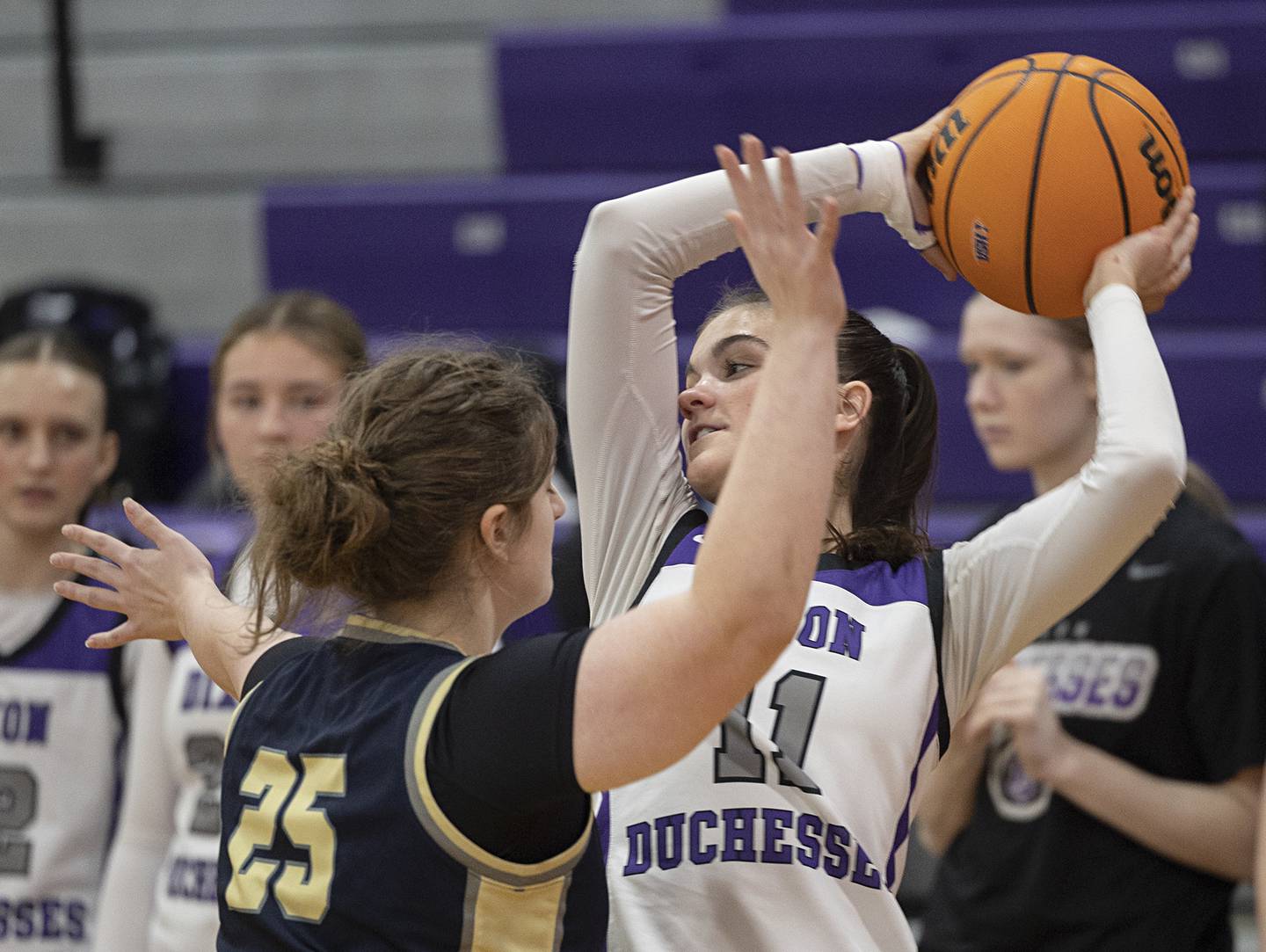 Dixon’s Kiley Gaither looks to pass against Harvest-Westminster’s Diana Dinapoli Wednesday, Feb. 11, 2026.
