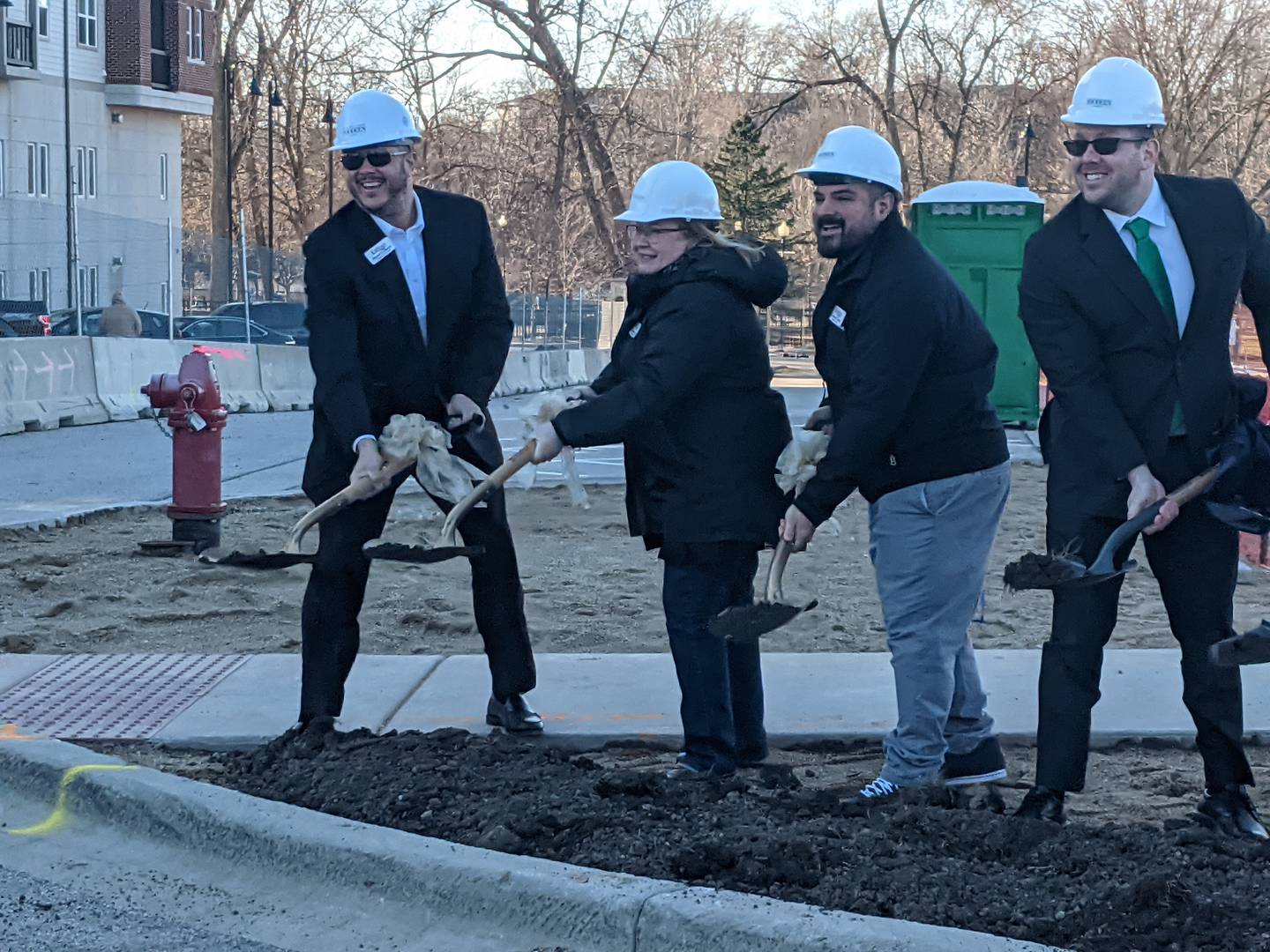 From left, Oswego Village Administrator Dan Di Santo, Village Trustee Karin McCarthy-Lange, Village Trustee Andrew Torres and Village President Ryan Kauffman participate in a March 17 groundbreaking ceremony for the second building for The Reserve at Hudson Crossing luxury apartment complex in downtown Oswego
