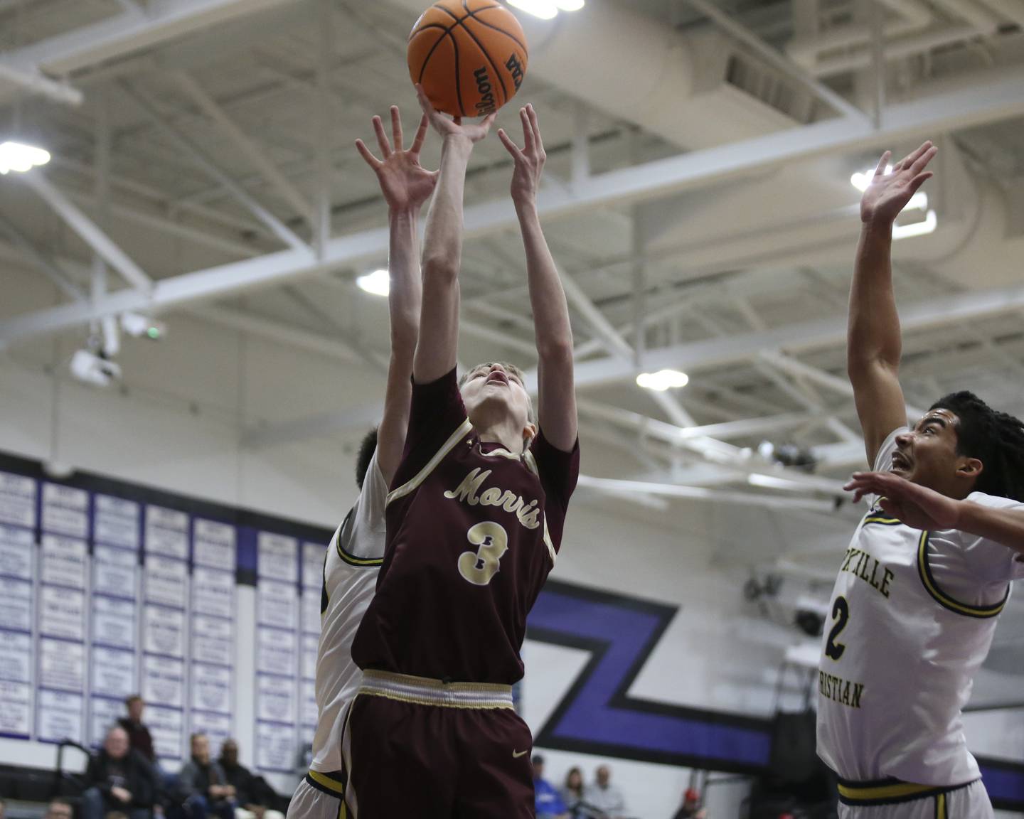 Morris's Cade Osborne (3) puts in a lay up during their Plano Christmas Classic basketball game between Morris at Yorkville Christian Friday, Dec 26, 2025 in Plano.