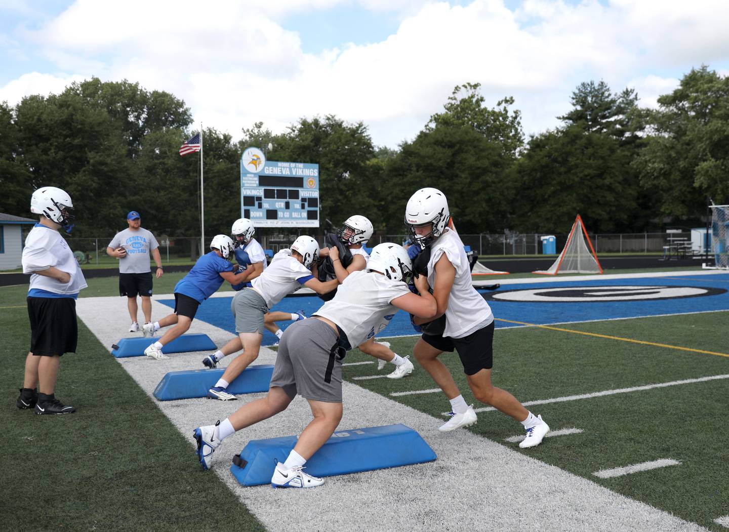 Geneva players run a drill during the first day of practice for the fall season on Monday, Aug. 7, 2023 at the school.