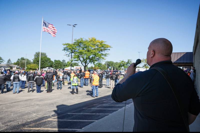 Woodstock Fire Lt. Eric Kristensen performs the national anthem during a Sept. 11 anniversary ride in Woodstock Sept. 6, 2025.