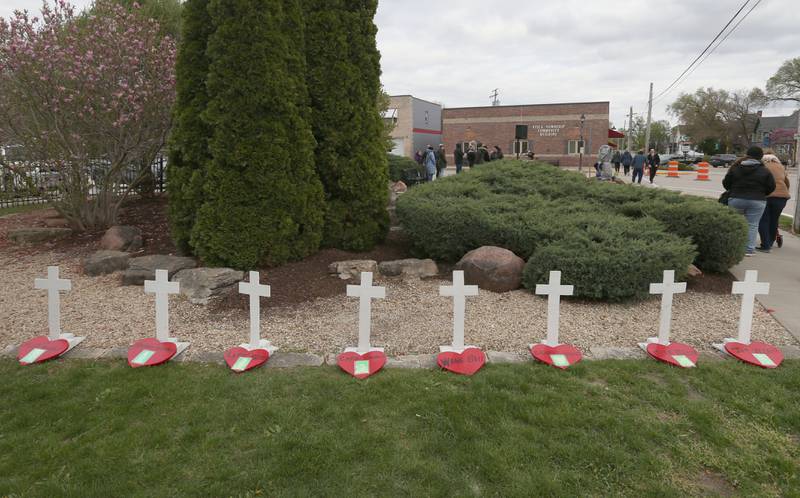 Eight wooden crosses honoring those died in the Milestone Tap are remembered at the Tornado Memorial for the 20th anniversary on Saturday, April 20, 2024 in Utica.