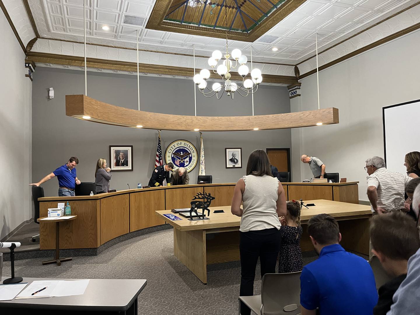 Dixon City Fire Department’s Deputy Chief Adam Arnould (middle left) is sworn in by Mayor Glen Hughes (middle right) at a city council meeting on Monday, Aug. 5. Arnould assisted council member Mary Oros (left) years ago during a medical emergency with her son.