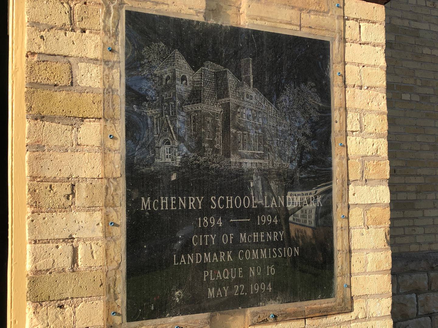 The city of McHenry placed a plaque on the school noting its history in the community in 1994, in recognition of the building's 100th birthday and seen here 30 years later, on Monday, April 15, 2024.