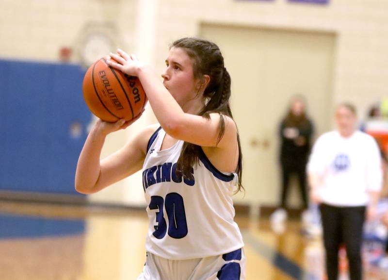 Geneva’s Keira McCann shoots three points during a game against St. Charles North at Geneva on Tuesday, Feb. 6, 2024.