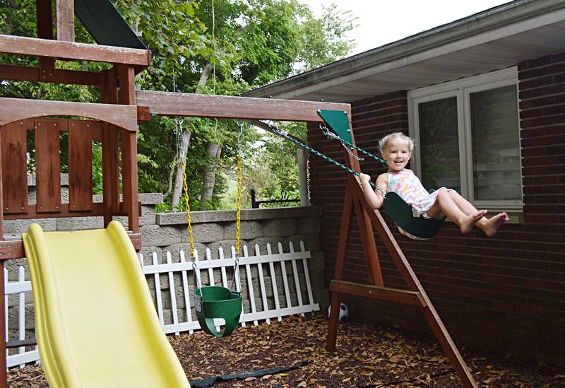 Aislynn Skinner, 4, of Oregon, swings in her backyard on Sept. 6, 2023. Aislynn, who was diagnosed with a critical congenital heart defect in utero, was selected as an American Heart Association Community Youth Heart Ambassador for the 2023-24 school year.