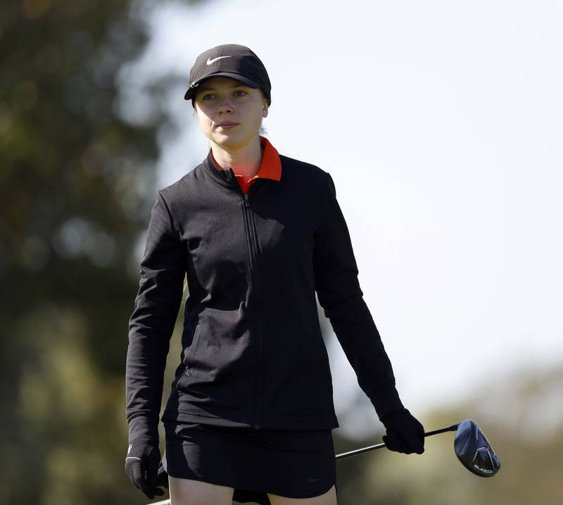 Claire Snider of Wheaton Warrenville South, reacts to her drive during the IHSA Class 2A West Chicago girls golf regional at St. Andrews Tuesday, Oct. 1, 2024 in West Chicago.