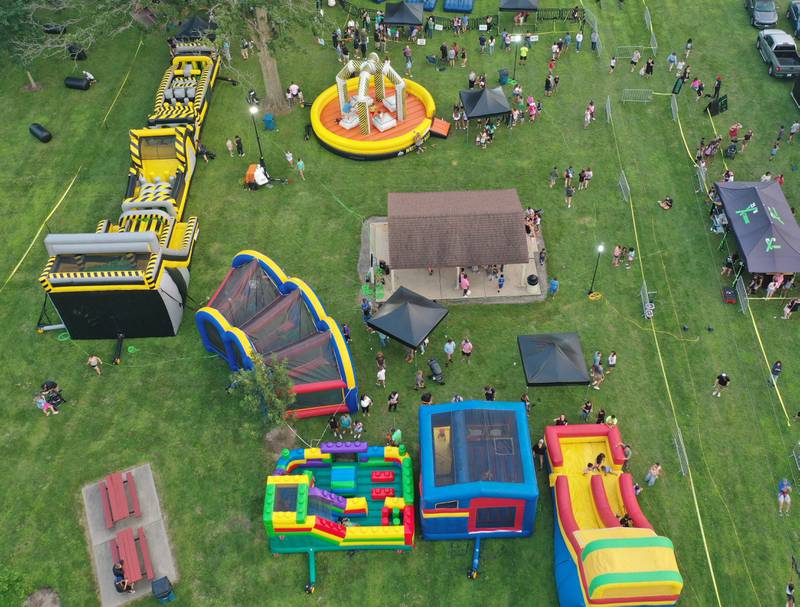 An aerial view of the fun zone during the The Taste of the Illinois Valley on Friday, Aug. 1, 2025 at Centennial Park in Peru. The event featured food vendors, live music, a beer tent and a kids zone, Dreamwave wrestling and Pandora's Box, a Aerosmith tribute band.